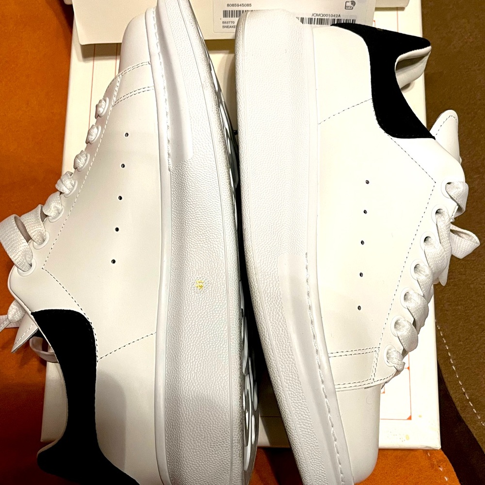 Selling like new worn once white Alexander McQueen sneakers.
